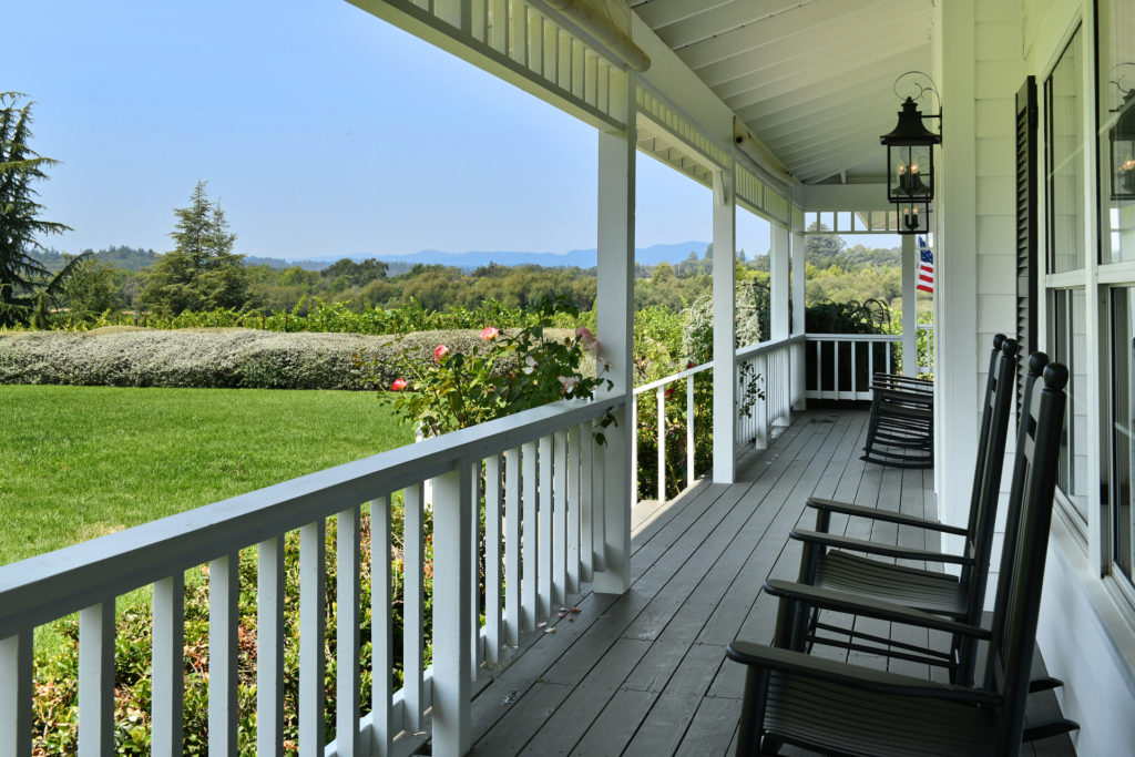 Rocking chairs on porch looking at view