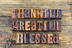 Letterpress type wood block thankful greatful helpful blessed religious message inspiration thank you positive help concept.